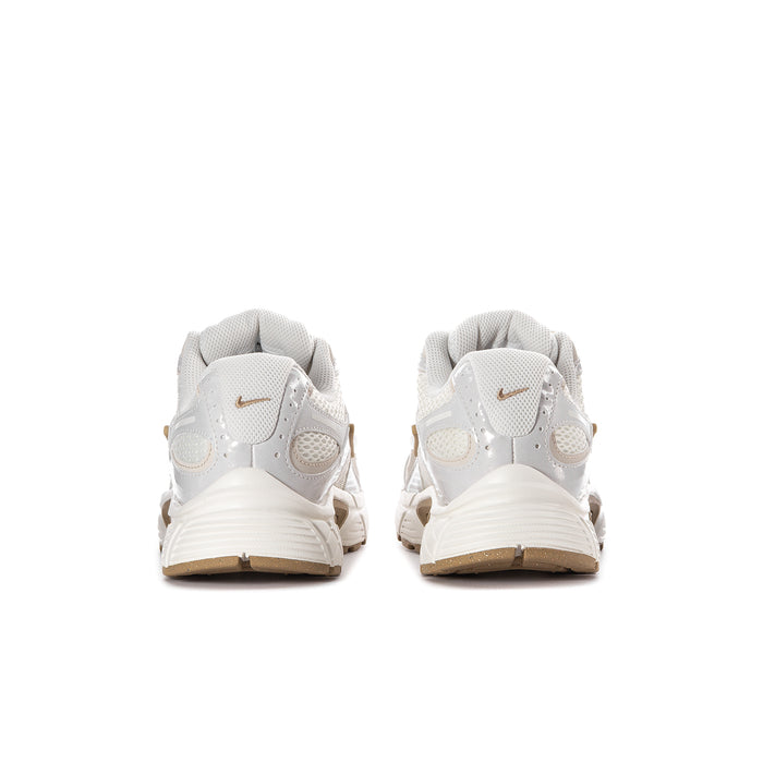 Women’s athletic sneaker rear view in white with tan heel and gold branding
