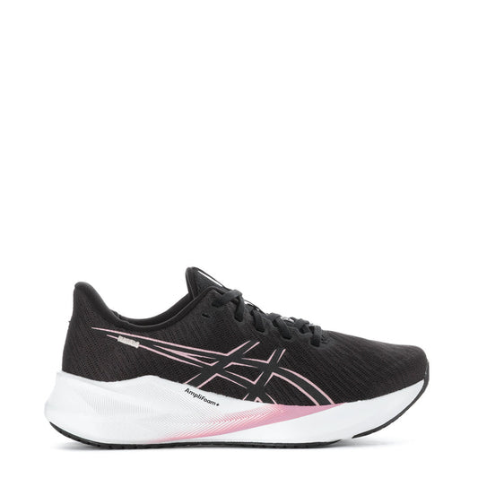 Women's black running shoes with pink accent logo and white sole