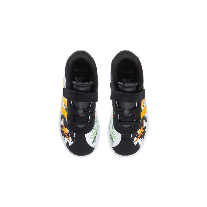 Kids' black sneakers, front view: cow-print toe and side graphics, white sole