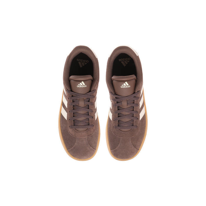 Youth sneakers front view, dark brown suede uppers with adidas logo and cream stripes.
