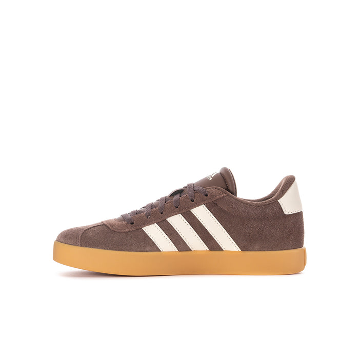 Youth sneakers side view, dark brown suede with cream stripes and lace-up front.