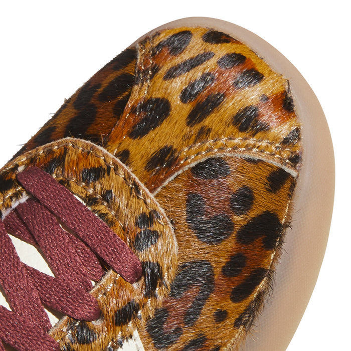 Close-up of youth shoe upper: leopard-print pony hair with burgundy lace detail