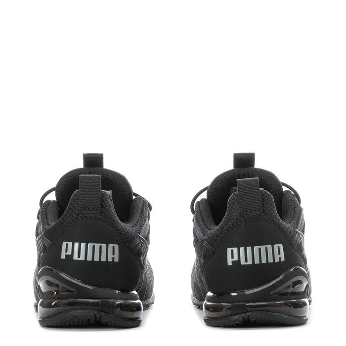 Kids black running shoes, heel back view with PUMA lettering