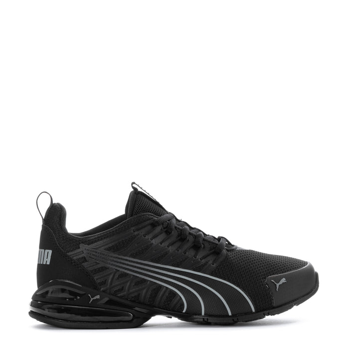 Youth black Puma sneakers with gray stripe detailing, lace-up and cushioned sole