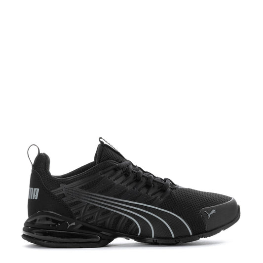 Youth black Puma sneakers with gray stripe detailing, lace-up and cushioned sole