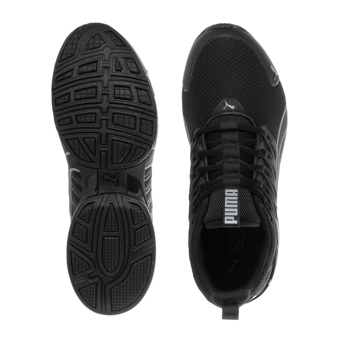 Youth black Puma sneakers bottom and side view, textured tread sole and lace-up upper
