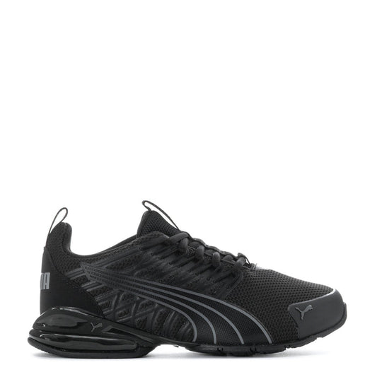 Black youth athletic sneakers with Puma logo, lace-up mesh upper and sculpted sole