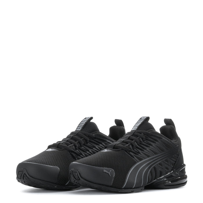 Pair of black youth athletic sneakers with mesh texture, laces, and Puma side branding