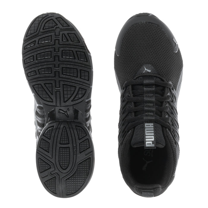 Black youth sneaker pair showing tread outsole and side mesh upper with Puma logo