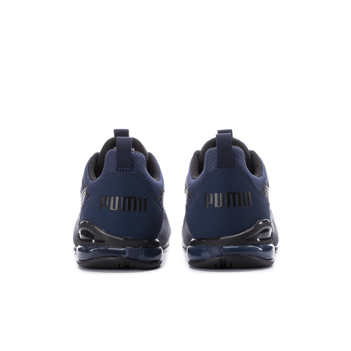 Navy sneakers with PUMA branding on heel and glossy air-cushion sole