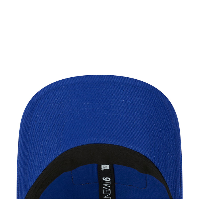 Blue 9TWENTY trucker cap interior label visible under the brim.