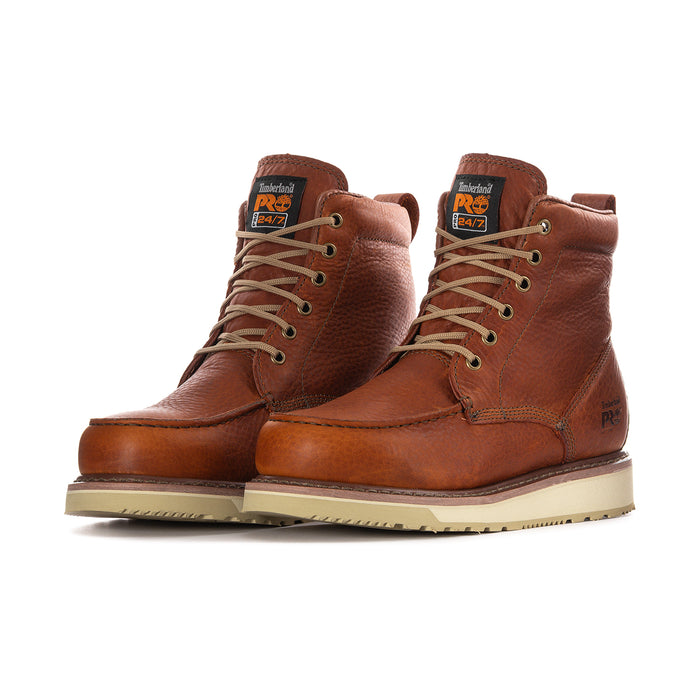 Pair of men's rust lace-up ankle boots with side stitching and light sole.