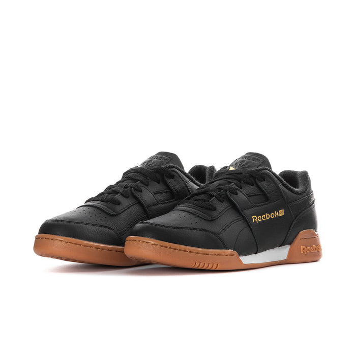 Men's black Reebok low-top sneakers with gold logo and gum sole trim