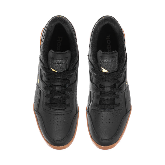 Pair of black Reebok sneakers showing padded tongue and lace-up interior