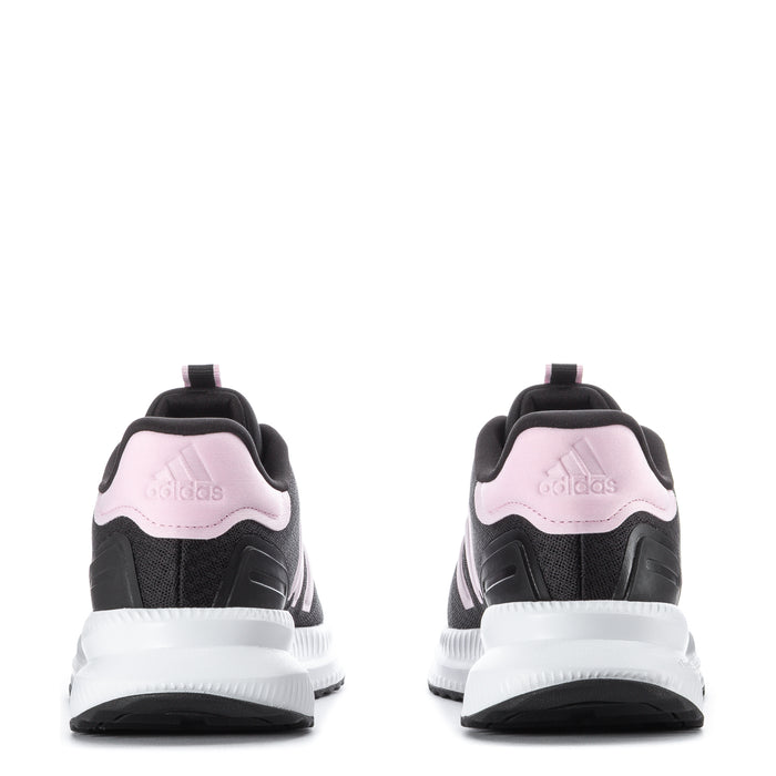 Women’s black sneakers from heel view with pink logo tab and white cushioned midsole