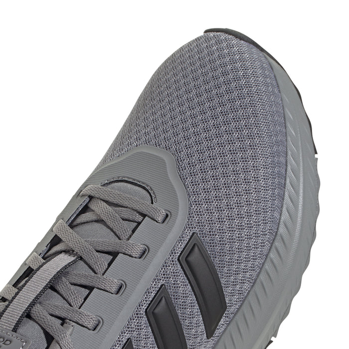 Grey knit side panel of men's running shoe with black stripe detail and grey laces