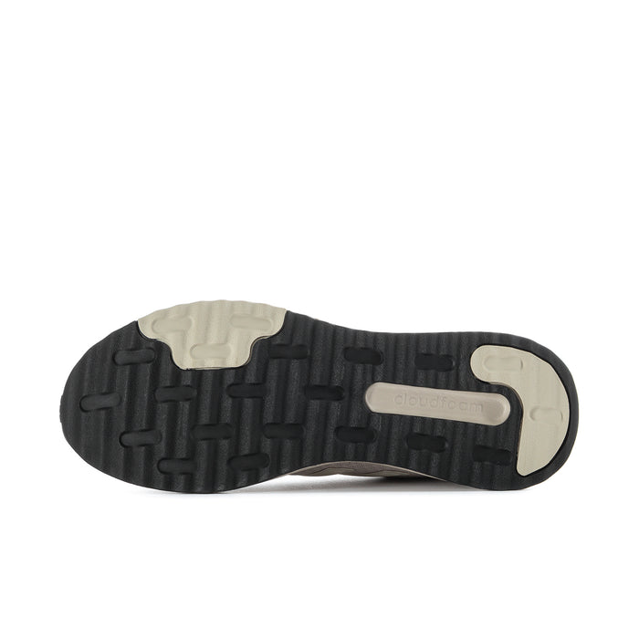 Men's sneaker outsole view with textured tread and light midsole on dark rubber base