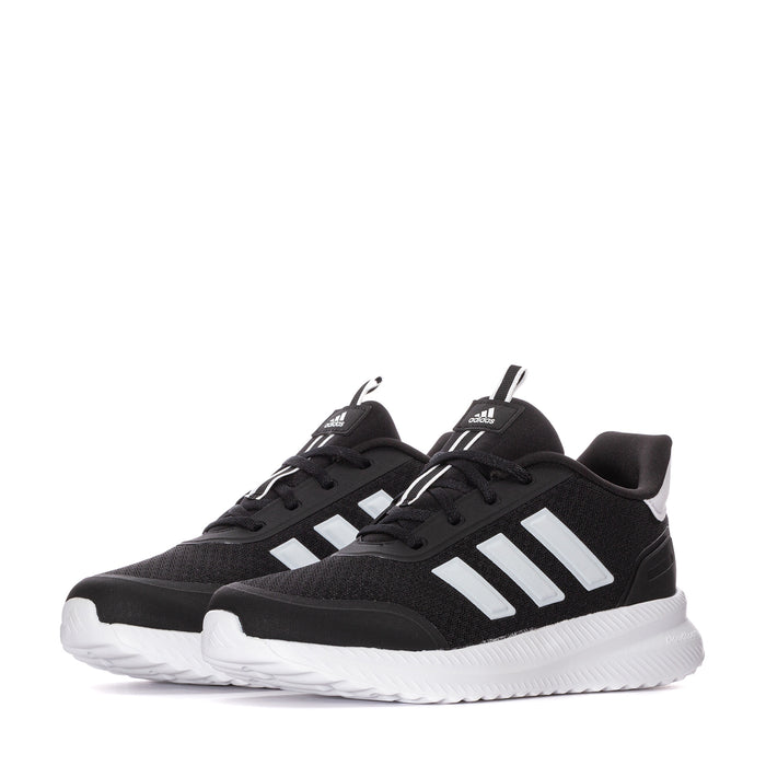 Pair of youth black adidas sneakers with white three-stripe detail and white midsoles