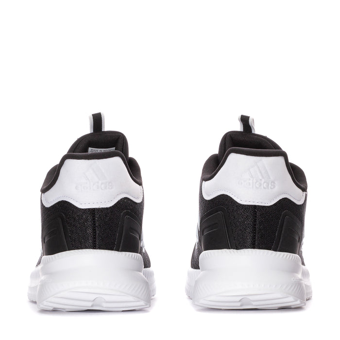 Back view of youth black sneakers with white heel panel and cushioned collar