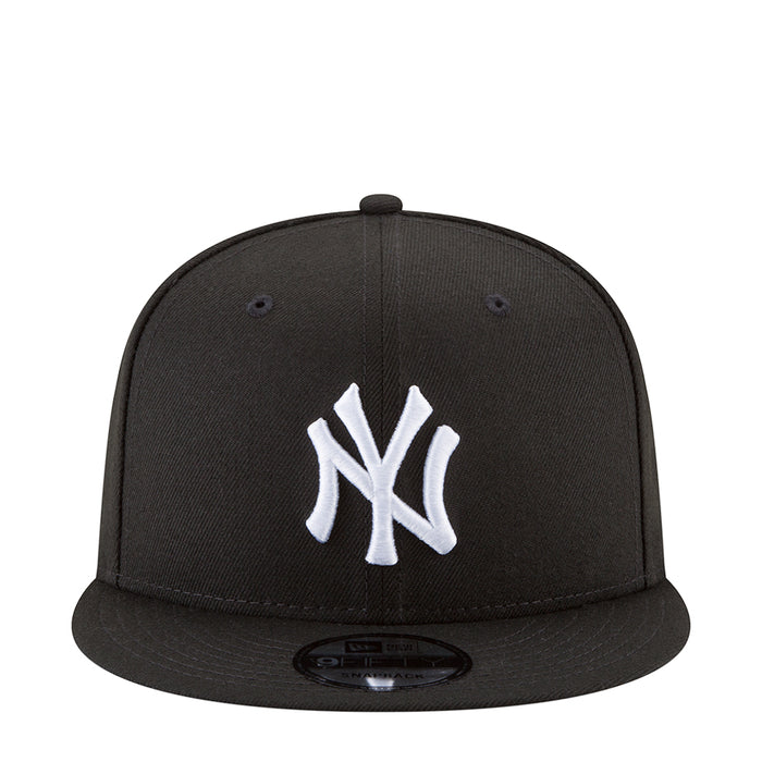 Black baseball cap with white NY Yankees logo on the front