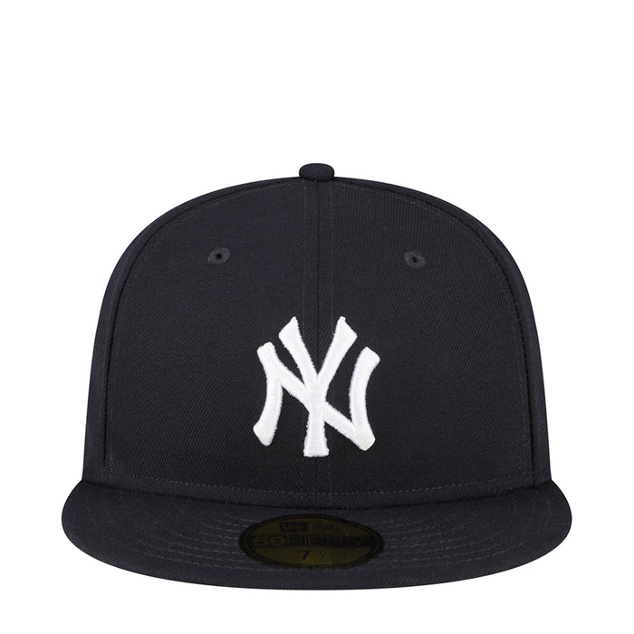 Dark baseball cap with white Yankees “NY” logo on the front panel
