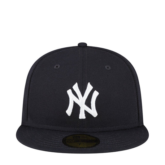 Dark baseball cap with white Yankees “NY” logo on the front panel