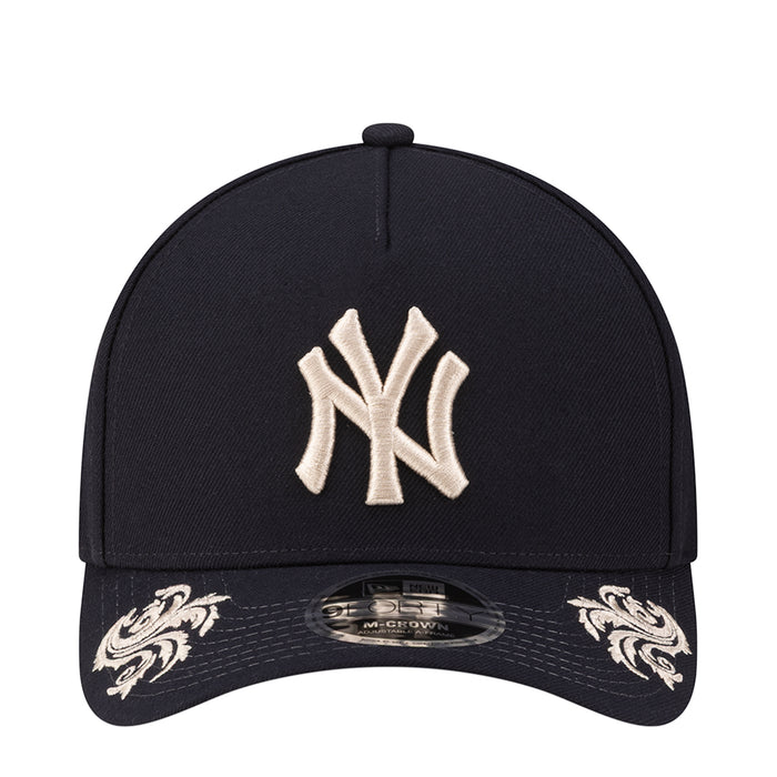Navy baseball cap with white Yankees logo embroidery on the front panel