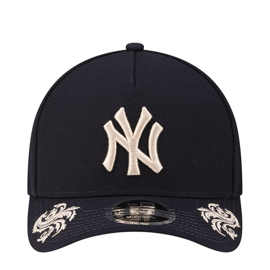 Navy baseball cap with white Yankees logo embroidery on the front panel