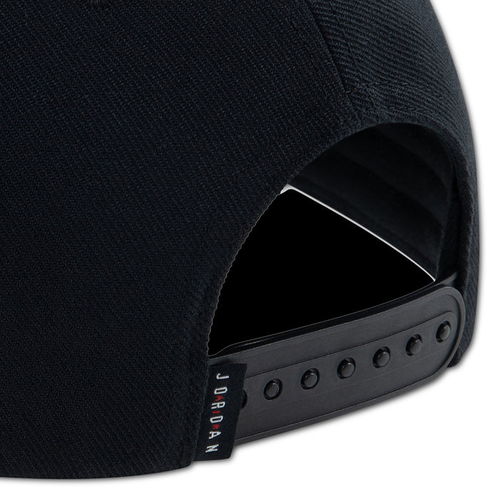 Black dad cap strap and eyelet panel on side, with red Jordan label
