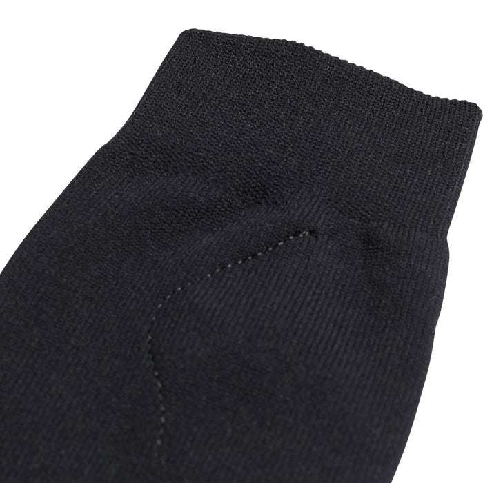 Black fabric sleeve for youth sock guard with stitched seam and elastic knit top