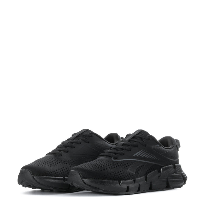 Black youth lace-up running shoes, angled view showing breathable mesh upper